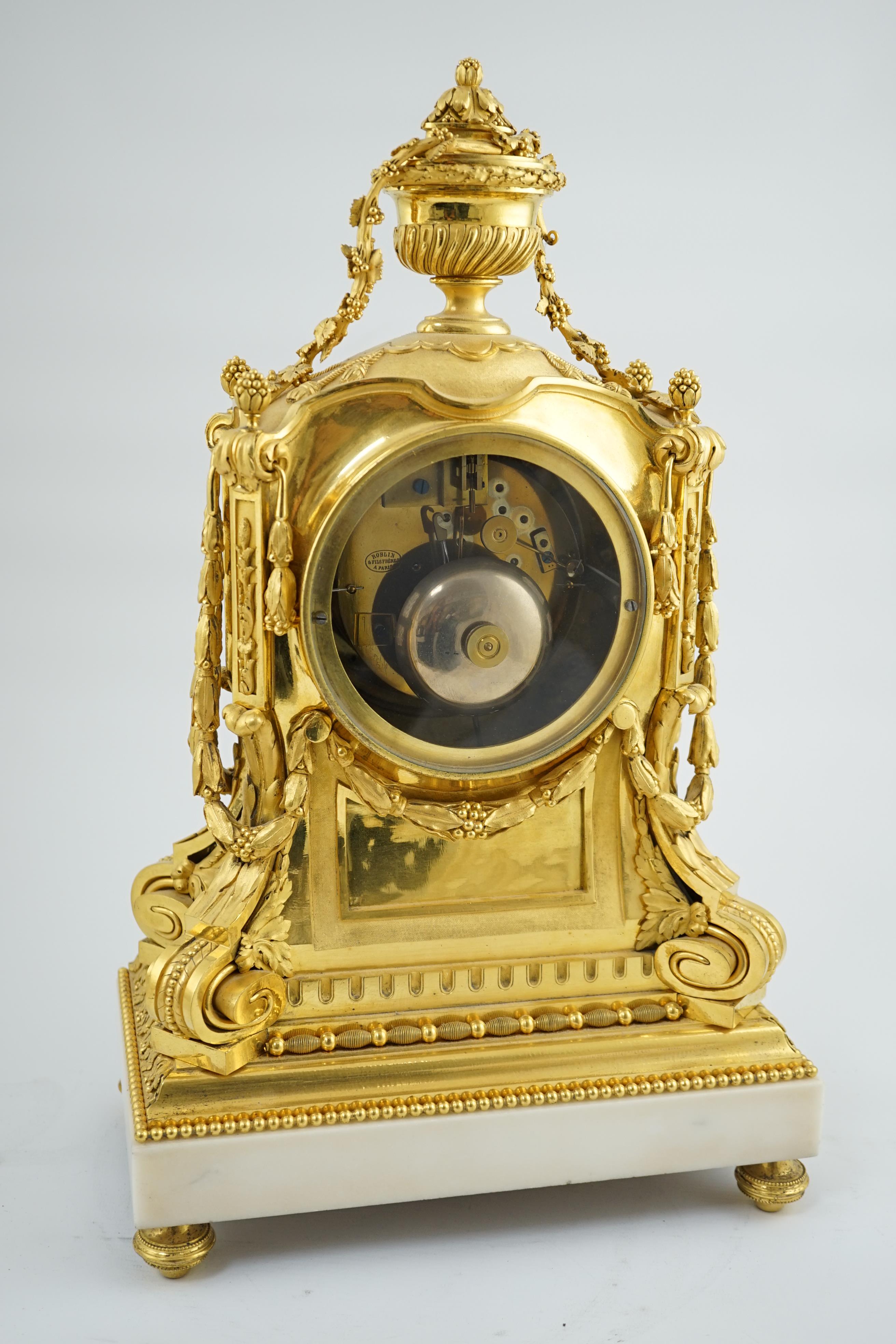 Roblin & Fils à Paris. A 19th century French Louis XV style ormolu and white marble mantel clock